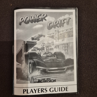 Power Drift videojáték kazetta és játékkalauz.